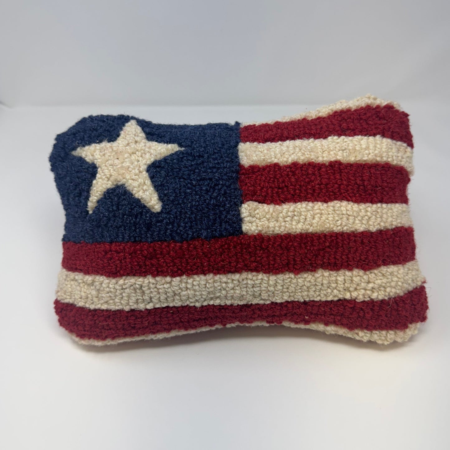Handmade American flag pillow with red, white, and blue colors on a white background