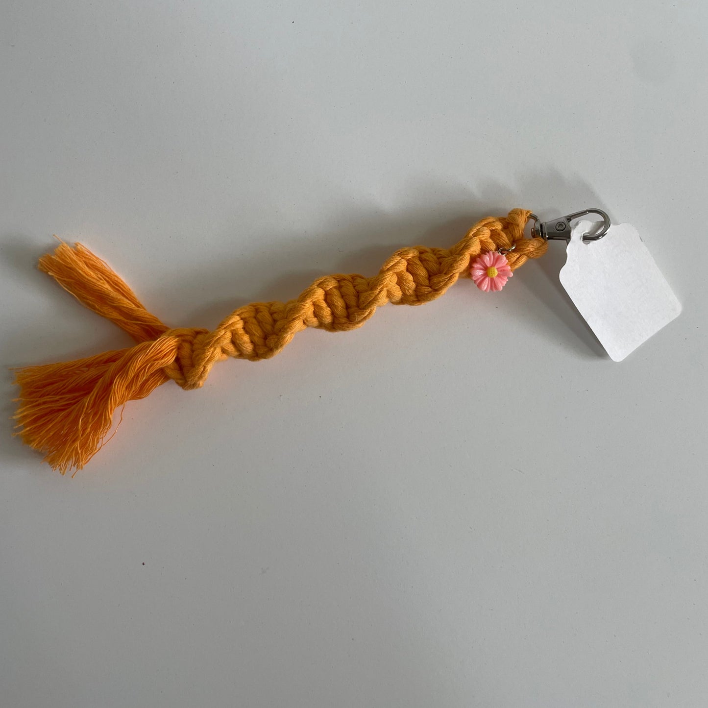 orange macramé keychain w/ flower charm
