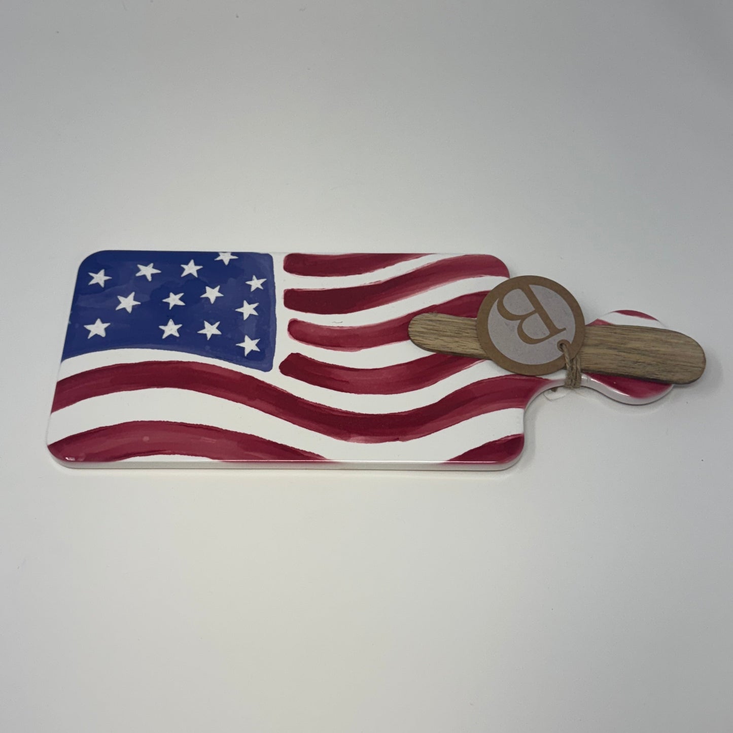 Charcuterie with American flag design and wooden handle on a white background