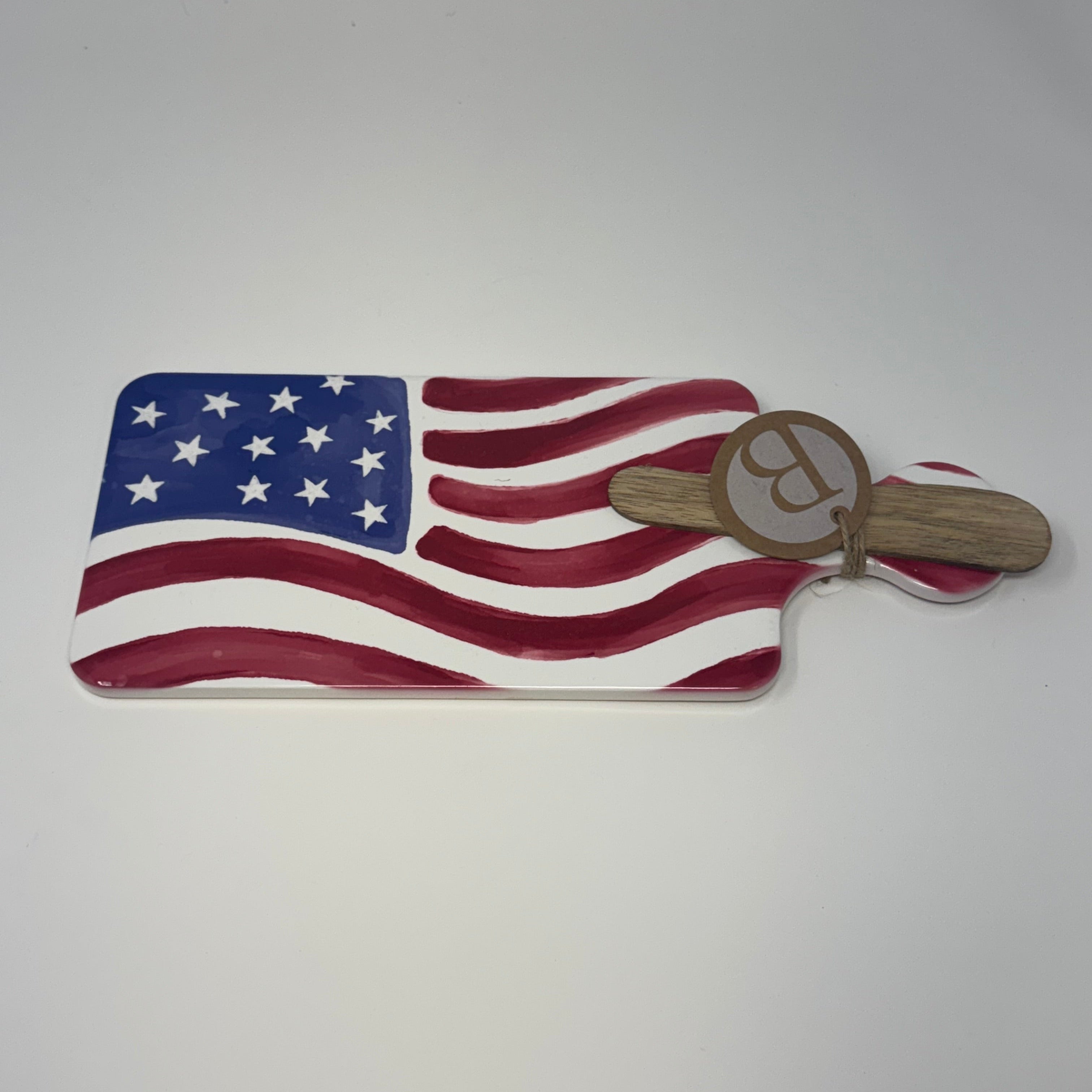 Charcuterie with American flag design and wooden handle on a white background