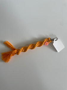 orange macramé keychain w/ flower charm