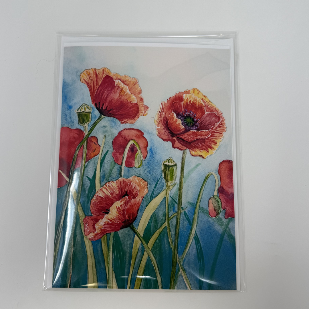 Framed artwork of red poppies on a white background