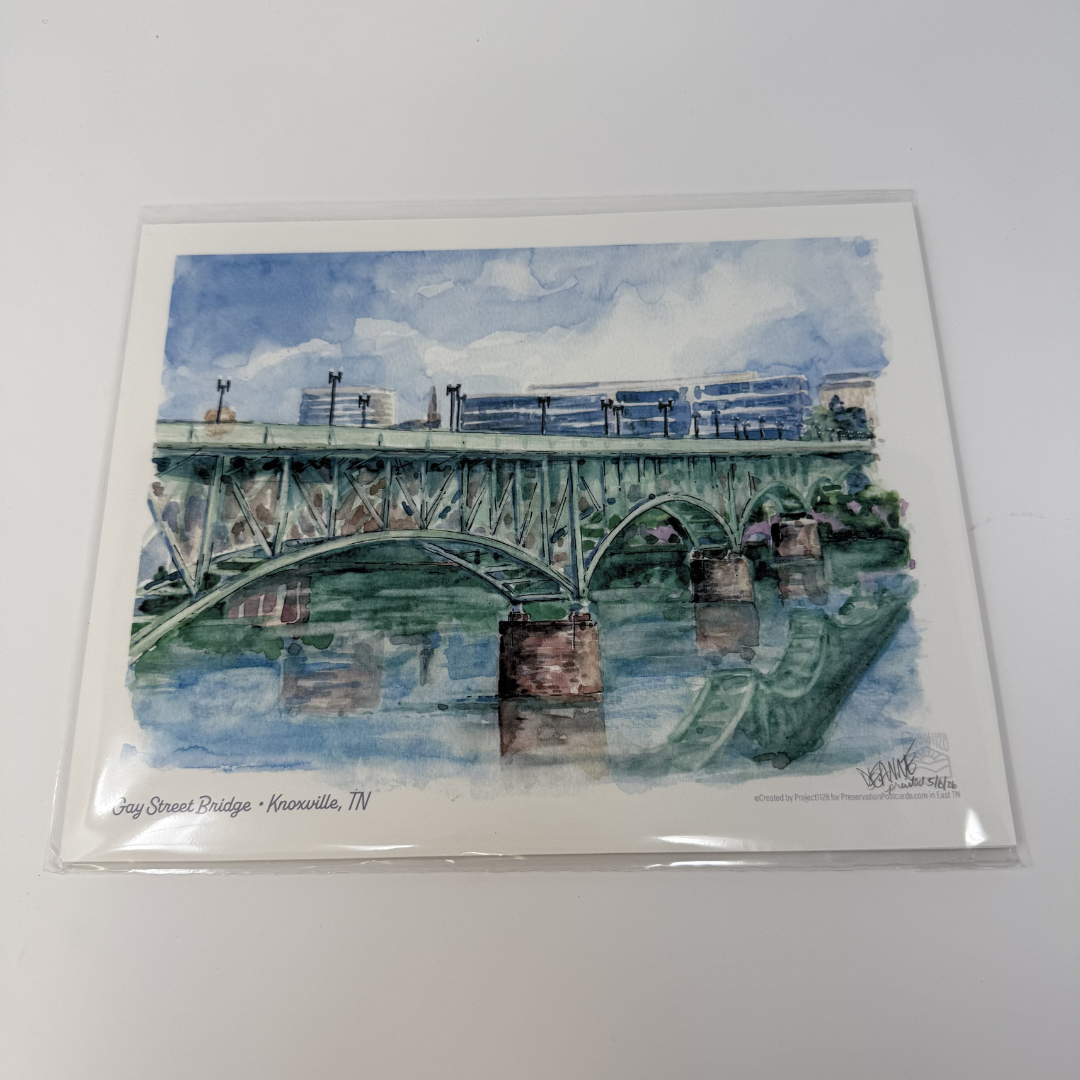 Watercolor painting of a bridge over water with a blue sky, on a white background.
