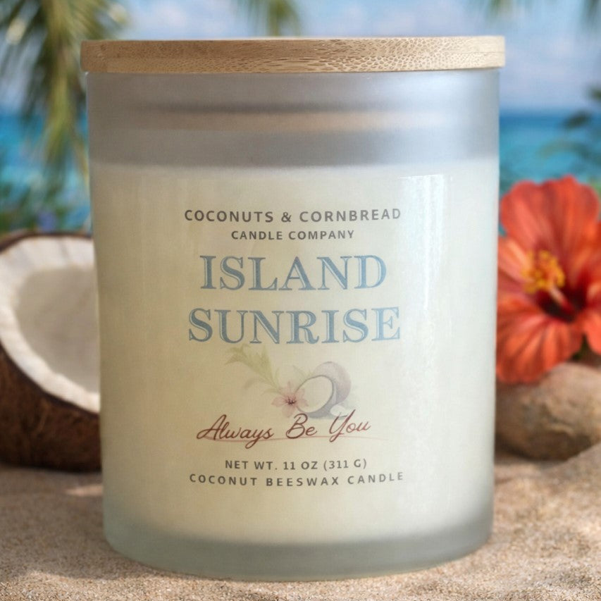 Candle labeled 'Island Sunrise' with tropical elements in the background